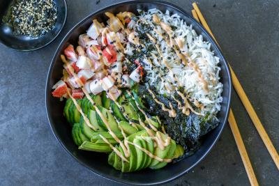 California Sushi Bowl with sauce and chop sticks.