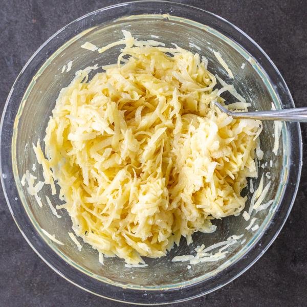 Combined latkes ingredients in a bowl