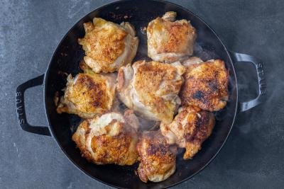 chicken browned in a pan