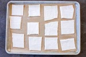 Cut into pieces puff pastry on a baking dish