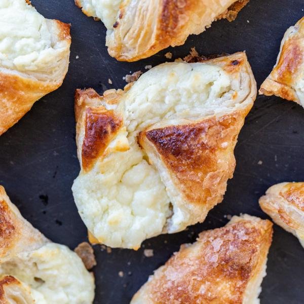 Puff Pastry Cheese Turnovers on a serving tray