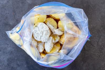 Potatoes and ranch seasoning in a zip lock bag