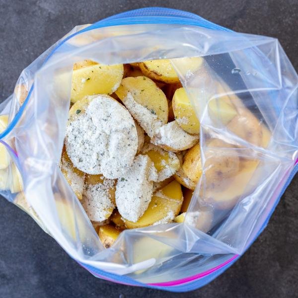 Potatoes and ranch seasoning in a zip lock bag