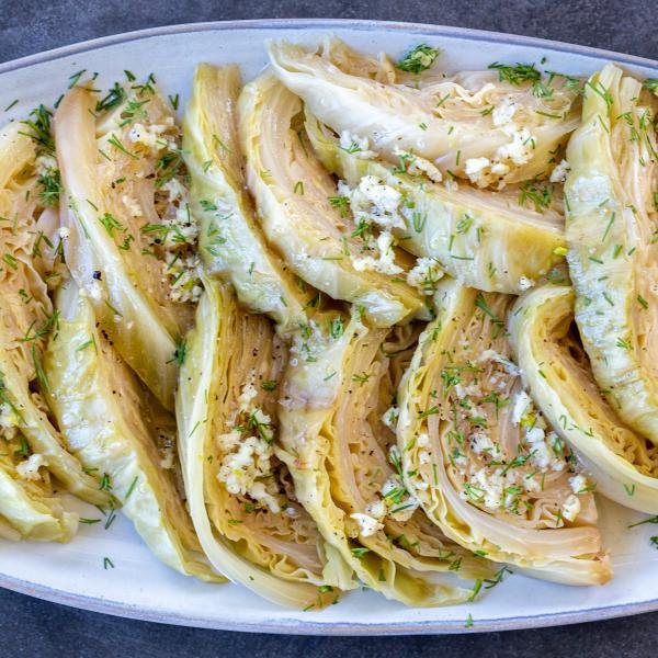 Cabbage with seasoning on a plate and herbs