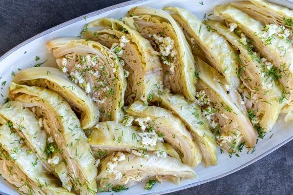 Cabbage with seasoning on a plate and herbs