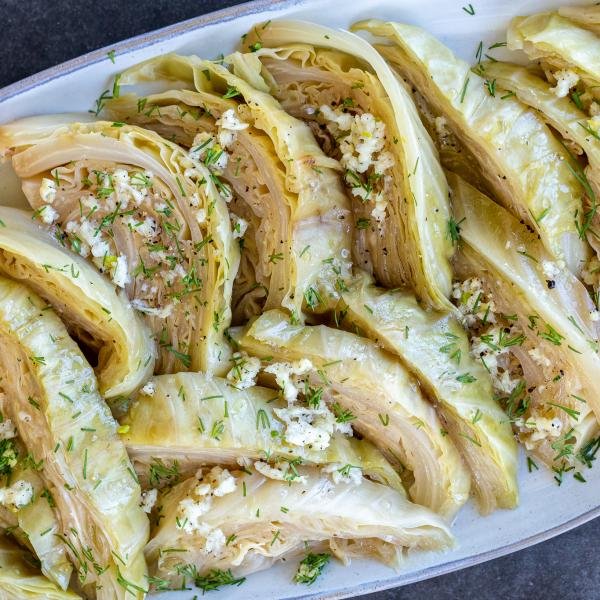 Cabbage with seasoning on a plate and herbs