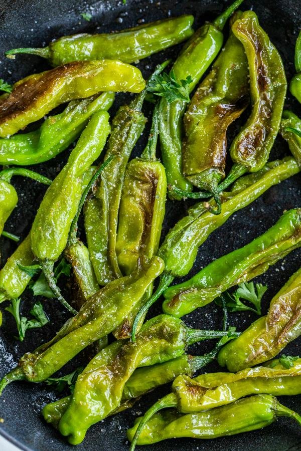 Sautéed Shishito Peppers in a pan 