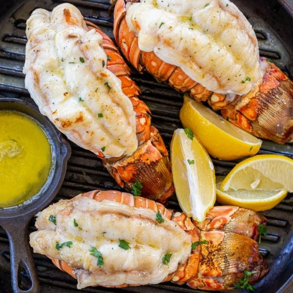 Grilled lobster tails with butter