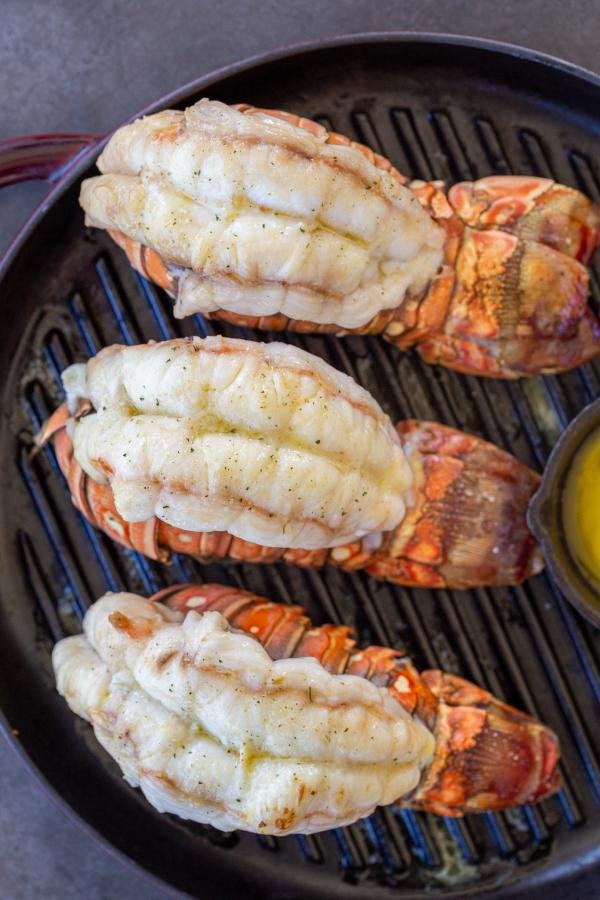 Grilled lobster with butter on a tray