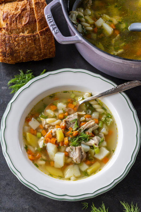Serving bowl of Herbed Chicken Noodle Soup.
