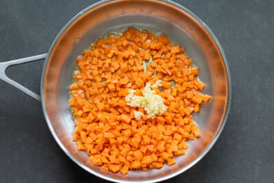 Carrots and garlic in a pan.