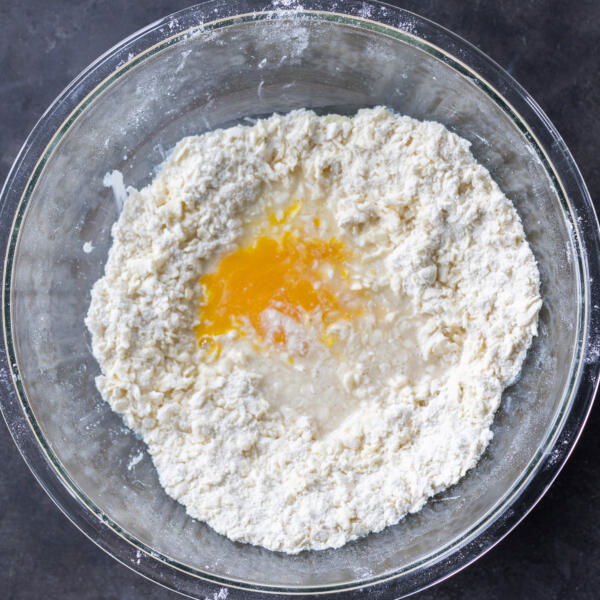 Egg and water added to the flour with butter.