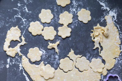 Cut out cookies on a floured surface.