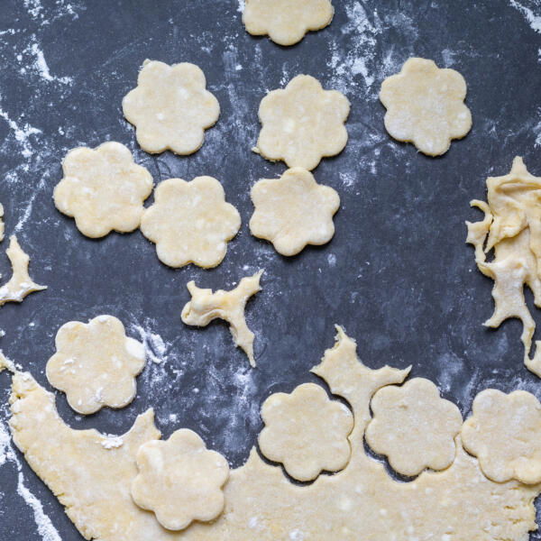 Cut out cookies on a floured surface.