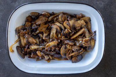 Mushroom and onion cooked in a bowl.