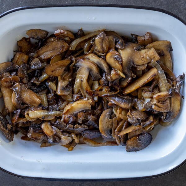 Mushroom and onion cooked in a bowl.