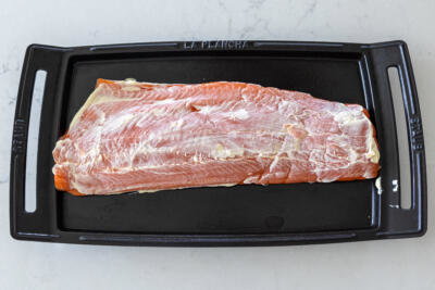 Salmon on a pan with mayo.