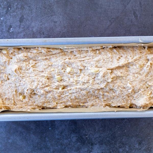 Banana bread batter in a pan