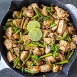 Chicken and Mushrooms with Asparagus in a pan.