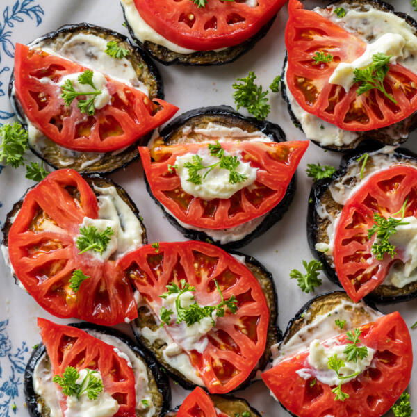 Plated Eggplant Appetizer with Tomato with herbs.