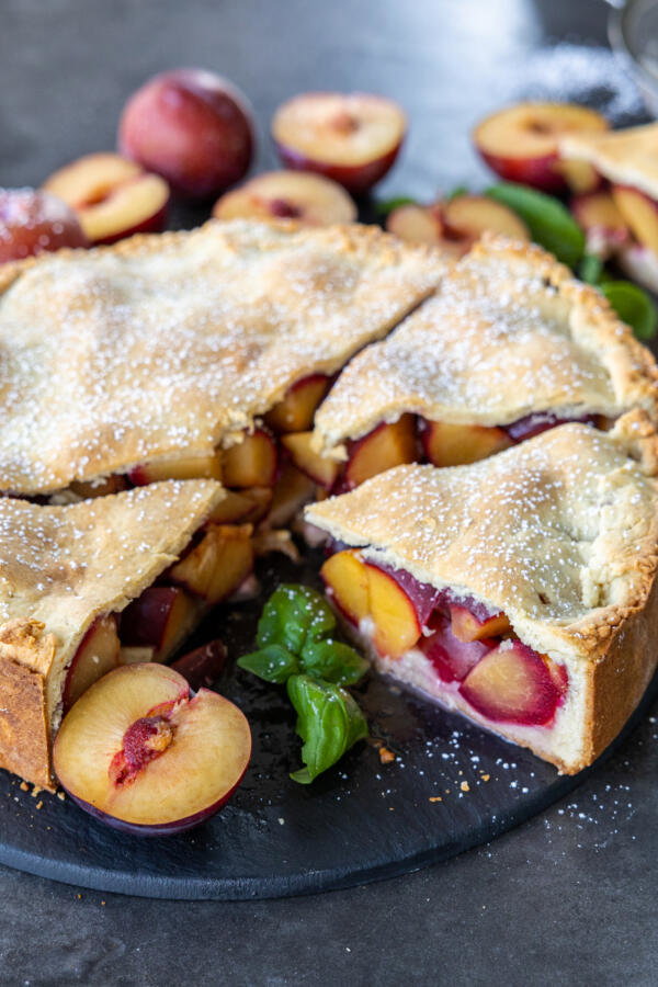 European Plum Pie sliced into pieces.