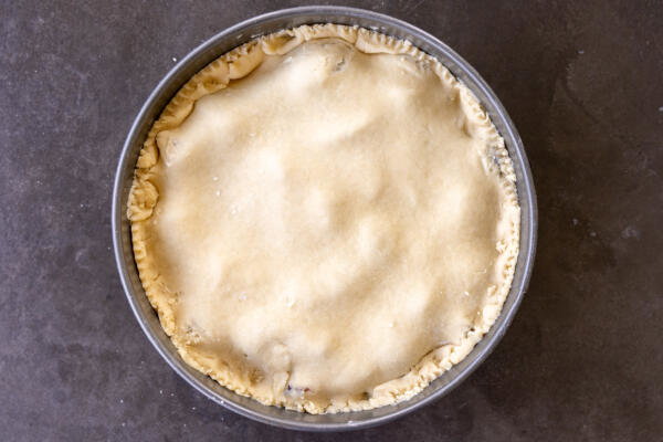 European Plum Pie before baking in a pan.