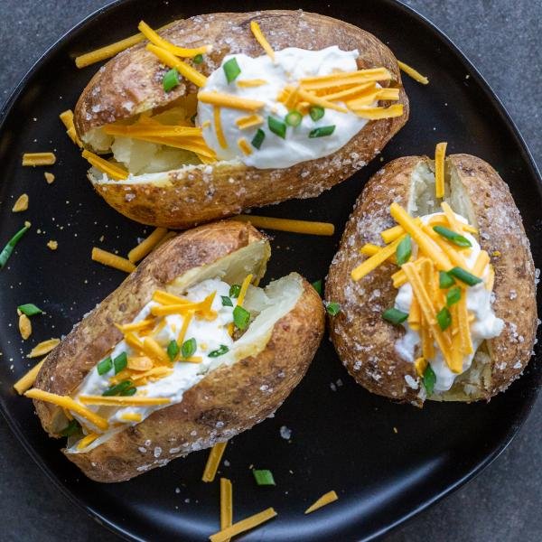 Baked potatoes with toppings on a plate