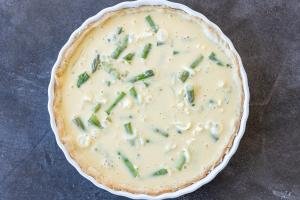 Asparagus Quiche in a baking pan before baking