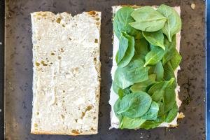 Mayo and spinach added to the focaccia