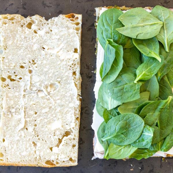 Mayo and spinach added to the focaccia