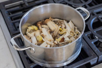 Mushrooms in a pot with water.