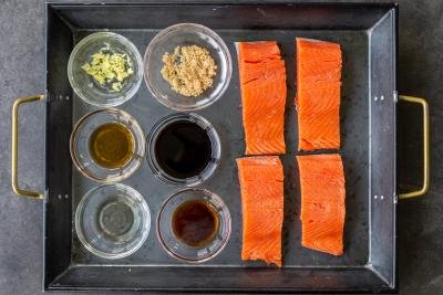 Baked teriyaki salmon ingredients on a tray.