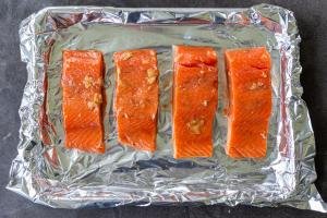 Teriyaki salmon on a baking sheet.
