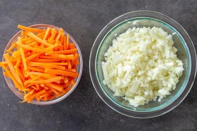 chopped onion and carrot in a bowl