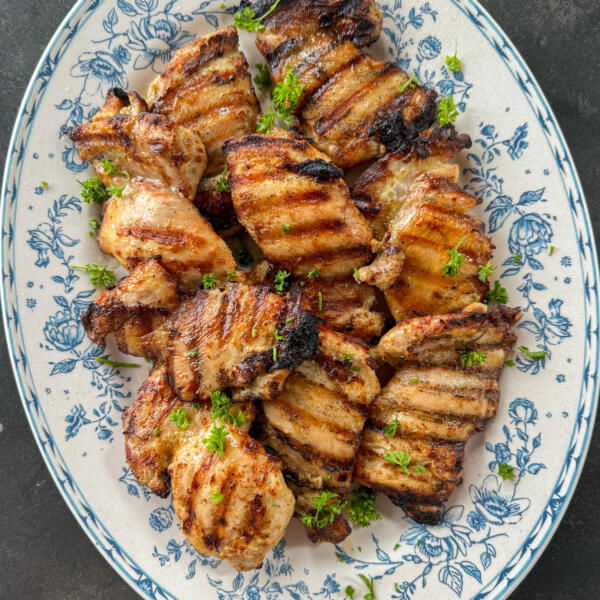 Serving plate with Grilled Chicken Thighs.