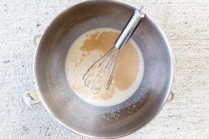 yeast with milk in a mixing bowl