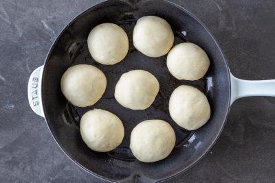 dough rolled up buns in pan