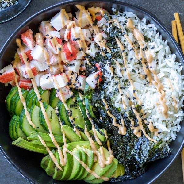 California Sushi Bowl with sauce and chop sticks.