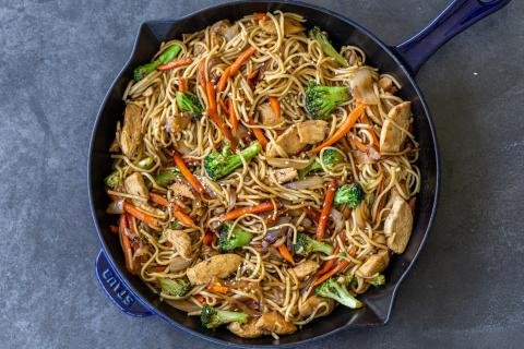 Chicken lo mein in a pan.