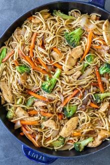 Chicken lo mein in a pan.