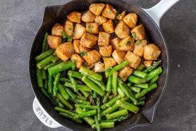 Chicken and Asparagus in a pan with herbs