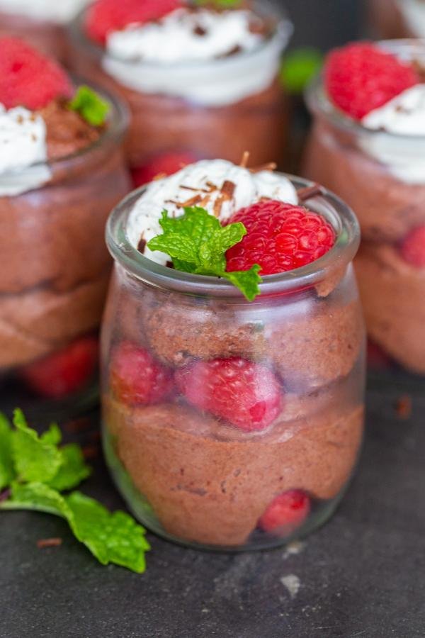 Chocolate Mousse cups with berries on top. 