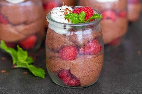 Chocolate Mousse cups with mint and raspberries in a cup.