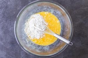 Eggs with flour in a bowl.
