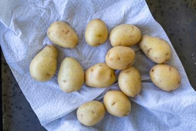 Washed potatoes on a paper towel