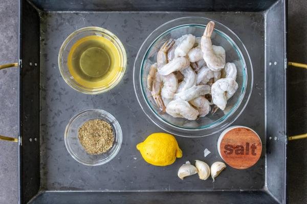 Ingredients for shrimp kabobs on a tray.