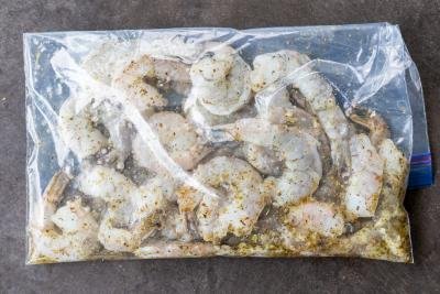 Shrimp marinading in a ziplock bag.