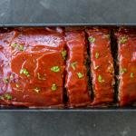 Baked Meatloaf Recipe with Oatmeal, sliced into pieces.