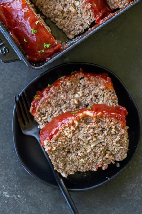 Sliced meatloaf on a plate.