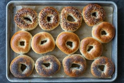 Baked bagels on a baking sheet.